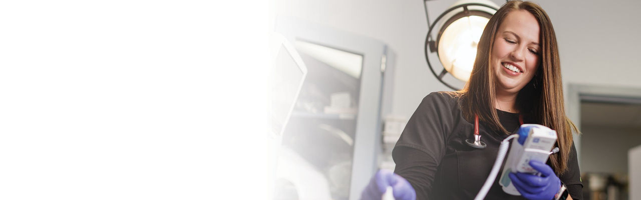 Smiling caregiver providing treatment