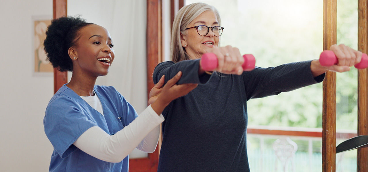 patient in rehab gym working with therapist