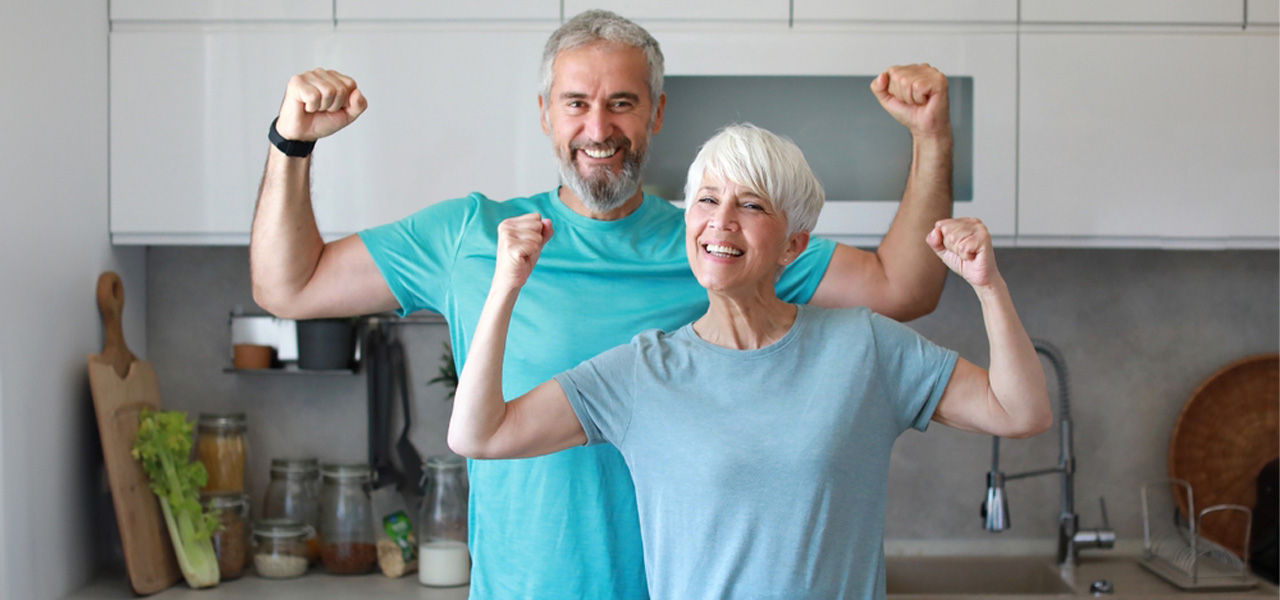 healthy couple flexing